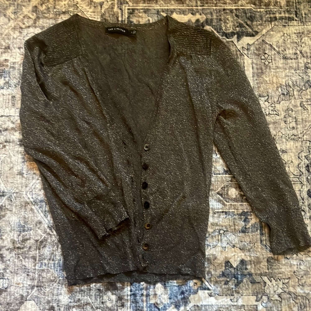 The limited size small, metallic three-quarter length button up cardigan
